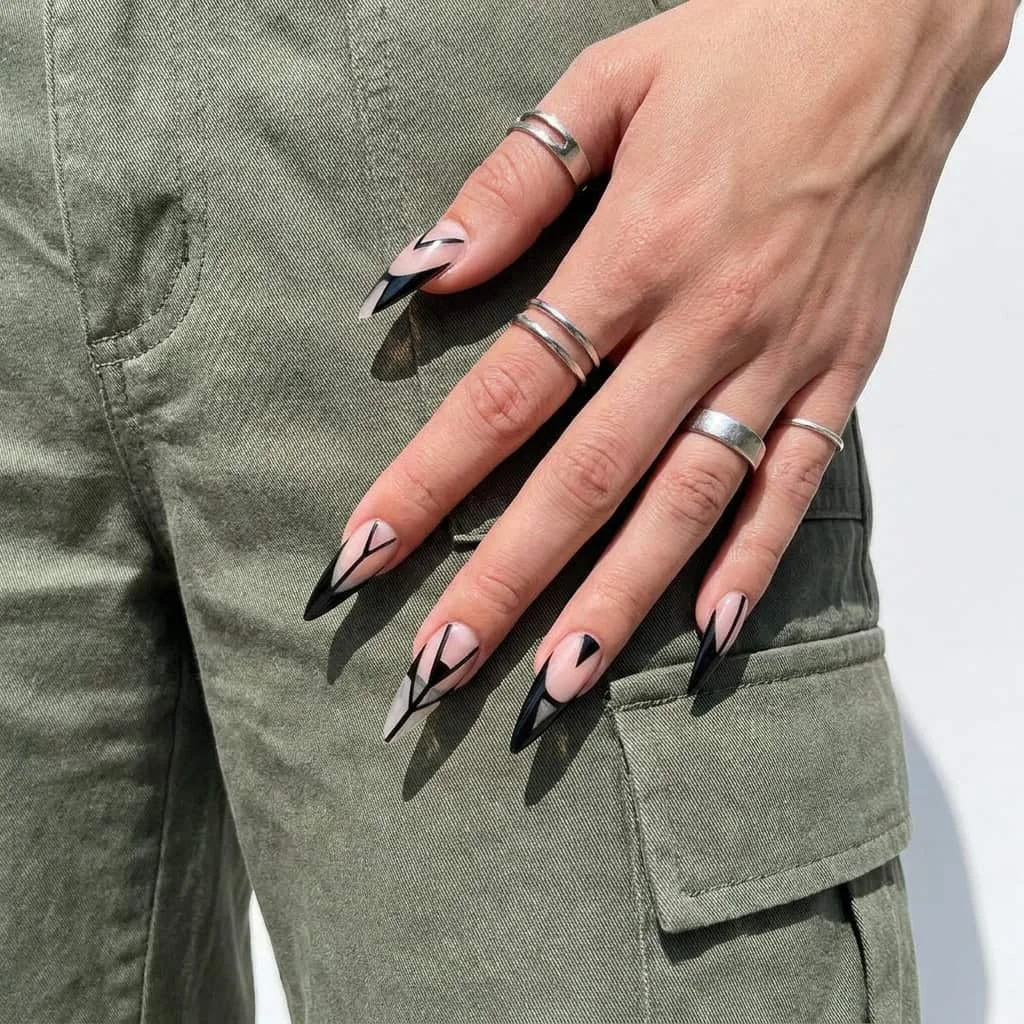 Negative space stiletto nails upgrading relaxed fall winter outfits casual streetwear.
